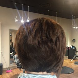 Elevation Salon & Spa - Shirley takes a asymmetric cut to a new level! And I love the copper shimmer that shows the layers in the cut. Loads of shine!