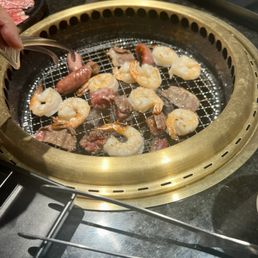 Shrimp, steak, sausages grilled. Shrimp, steak, sausages grilled.