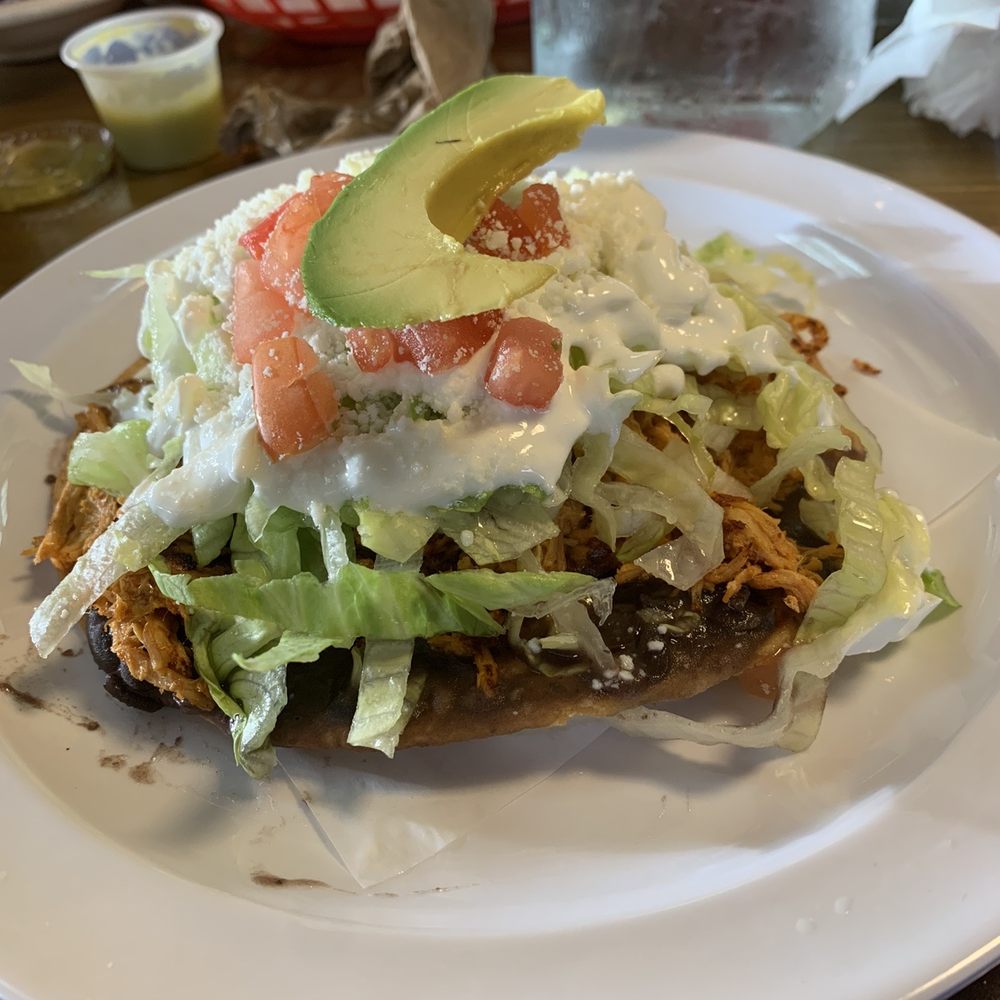 Michelada House II - Tostada with lettuce, crema, avocado, tinga de pollo and black bean spread on bottom... totally delicious - Mexican Near Me - Jackson Heights, New York Michelada House II - Tostada with lettuce, crema, avocado, tinga de pollo and black bean spread on bottom... totally delicious - Mexican Near Me - Jackson Heights, New York
