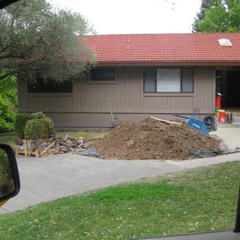 MT Higgins Construction - a pile of dirt in front of a house - General Contractors Near Me MT Higgins Construction - a pile of dirt in front of a house - General Contractors Near Me