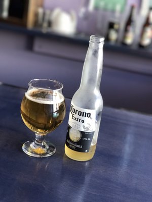 Photo of Northeast Oyster - Mamaroneck, NY, US. Corona in a glass. Crisp and cold. Perfect with my oysters. 68° in February calls for a cold one.