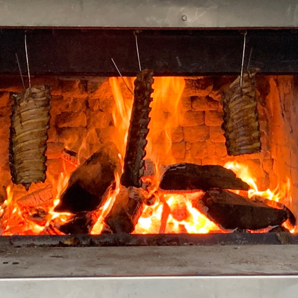 Walt's Hitching Post - Ribs cooking in the pit. - New American Near Me - Fort Wright, Kentucky Walt's Hitching Post - Ribs cooking in the pit. - New American Near Me - Fort Wright, Kentucky