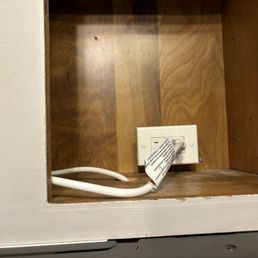 Outlet in cabinet above stove. Outlet in cabinet above stove.