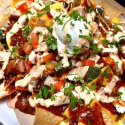 Loaded and stacked nachos and fries .. a lil extra TLC for all of us tonight !