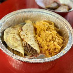 TacoMania - Carne asada and brisket tacos with rice.