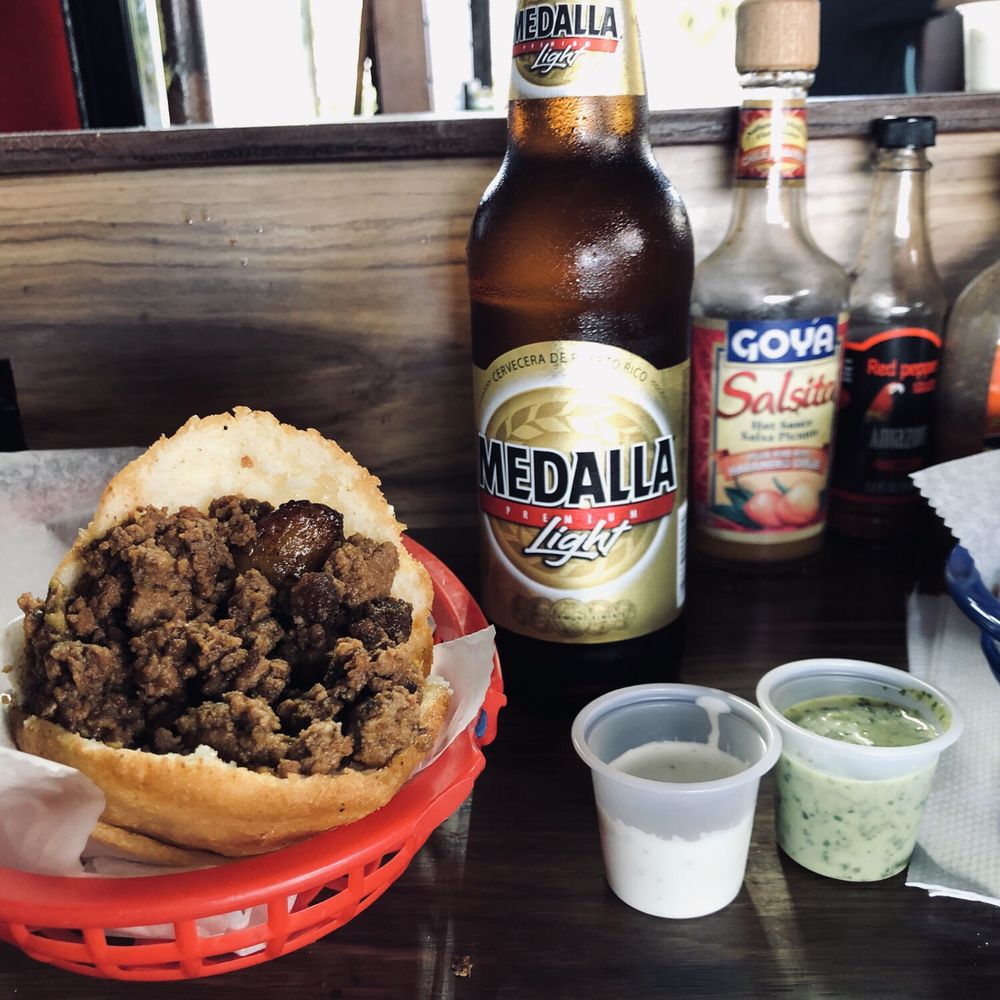Los Chamos Arepas - Pionono arepa with a medalla - Venezuelan Near Me - Carolina, Puerto Rico