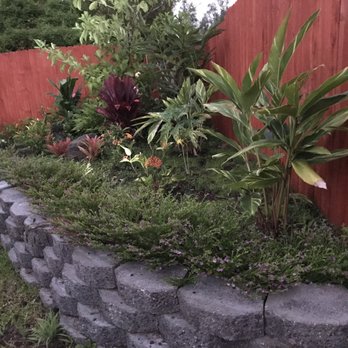 Irrigation Solutions & Landscape - a garden with a retaining wall - Irrigation Near Me - Kailua-kona, Hawaii