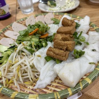 Saigon 512 - Banh Cuon with tofu. The other versions would have the meat stuffed inside, whereas the tofu is on top. - Vietnamese Near Me - Round Rock, Texas Saigon 512 - Banh Cuon with tofu. The other versions would have the meat stuffed inside, whereas the tofu is on top. - Vietnamese Near Me - Round Rock, Texas