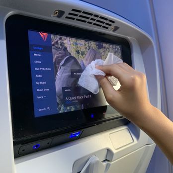 Delta Air Lines - Cleaning the touchscreen - Airlines Near Me - Orlando, Florida