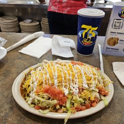 Skyline Chili - Burrito  smothered in chili and habanero cheese .