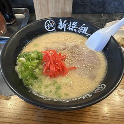 Shin-Sen-Gumi Hakata Ramen & Udon - Irvine - A bowl of Shin-Sen-Gumi's signature Hakata ramen with rich tonkotsu pork broth, chashu pork, green onions, sesame seeds, and red pickled gin