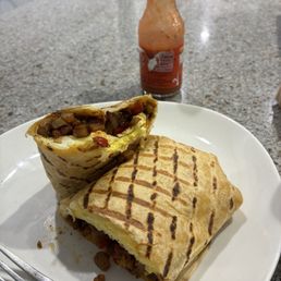 Breakfast Burrito and of course some hot sauce! Breakfast Burrito and of course some hot sauce!