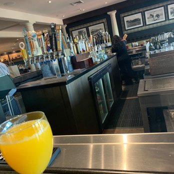 Bar Six40 - a glass of orange juice on a bar - Bars Near Me - Scottsdale, Arizona
