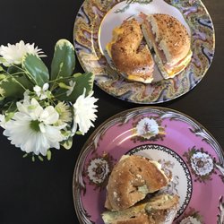 Cazenovia Bagel - Top-everything bagel with ham, cheddar and egg Bottom- energy whole wheat bagel with chives cream cheese, egg and lox