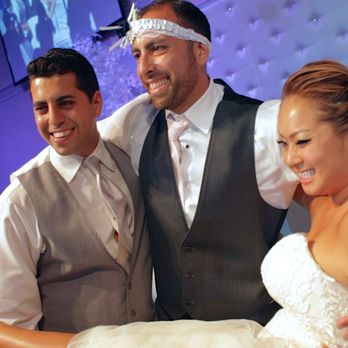LA CINEMA - The bride and the groom. The garter belt is on the head of the groom's brother. - Videographers Near Me - Los Angeles, California LA CINEMA - The bride and the groom. The garter belt is on the head of the groom's brother. - Videographers Near Me - Los Angeles, California