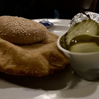 Garzanelli’s Supper Club - Pork tenderloin sandwich with pickles (didn't use flash so photo is a bit dark) - Italian Near Me - Oglesby, Illinois Garzanelli’s Supper Club - Pork tenderloin sandwich with pickles (didn't use flash so photo is a bit dark) - Italian Near Me - Oglesby, Illinois