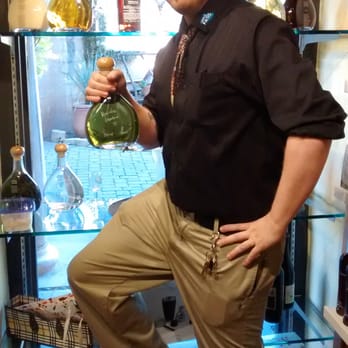 Spirits & Spice - Hank with my prized specialty bottle and Ellen rocks! - Beer, Wine & Spirits Near Me - Sedona, Arizona