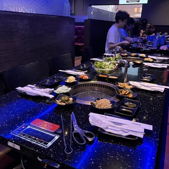 Manna Korean BBQ - Carrollton - a long table full of food - Korean Near Me - Carrollton, Texas Manna Korean BBQ - Carrollton - a long table full of food - Korean Near Me - Carrollton, Texas