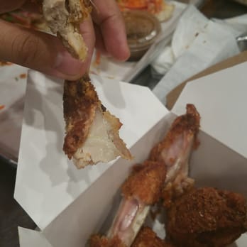 Baos Hog - Undercooked salt pepper wings.... yuck!  look at the comparison of cooked chicken from the hot chick Bao vs the wings in the back. BEWARE!!! - Chinese Near Me - Garden Grove, California