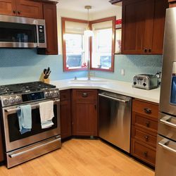 We kept our existing cabinets and Olive Mill replaced the counters and backsplash