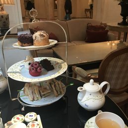 Wonderful afternoon tea! Scones/pastries on top, desserts in the middle, and sandwiches on the bottom (complete afternoon tea set)