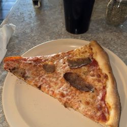 Pizza Palace - A slice of pizza with sausage. Yum