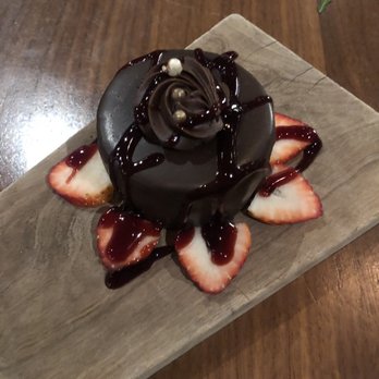 District - Flourless cake. With strawberry and raspberry chocolate garnish - Cocktail Bars Near Me - Los Angeles, California