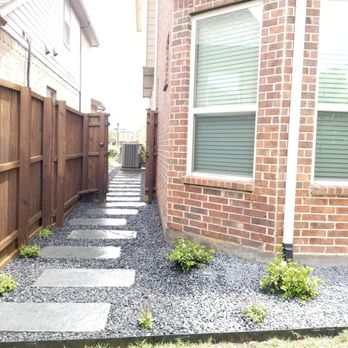 Olin Landscape Maintenance - a walkway between two houses - Landscaping Near Me Olin Landscape Maintenance - a walkway between two houses - Landscaping Near Me