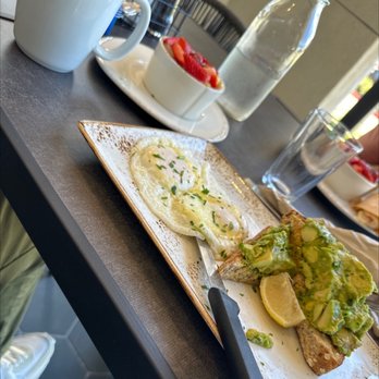 First Watch - Avocado toast, with poached eggs, and side of fresh fruit - Breakfast & Brunch Near Me - Houston, Texas First Watch - Avocado toast, with poached eggs, and side of fresh fruit - Breakfast & Brunch Near Me - Houston, Texas