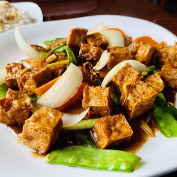 Thai Sana Restaurants - tofu and vegetables on a white plate - Thai Near Me - Ellsworth, Maine Thai Sana Restaurants - tofu and vegetables on a white plate - Thai Near Me - Ellsworth, Maine