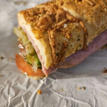 Subway - a half eaten sandwich on a piece of paper - Sandwiches Near Me - Columbia, South Carolina