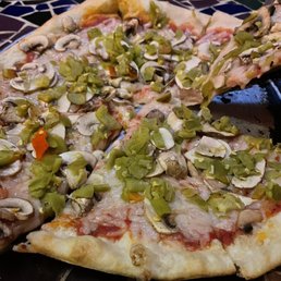 Vegan cheese pizza with hatch green chilis and mushrooms