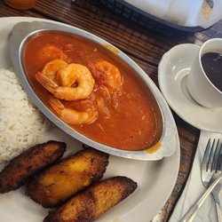 Mama's Latin Cafe - Camarones en salsa, rice, black beans. It was excellent.