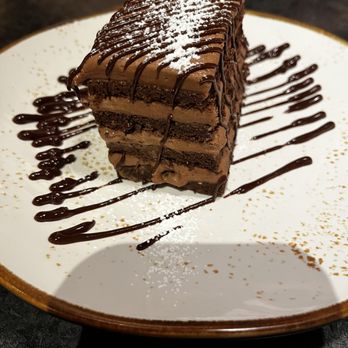 Michael's Tavern & Steakhouse - Four-layer Chocolate Cake! - Steakhouses Near Me - Indian River, Michigan Michael's Tavern & Steakhouse - Four-layer Chocolate Cake! - Steakhouses Near Me - Indian River, Michigan