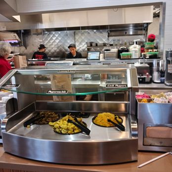 Habit Burger & Grill - a counter with a variety of food items - Burgers Near Me - Royal Palm Beach, Florida Habit Burger & Grill - a counter with a variety of food items - Burgers Near Me - Royal Palm Beach, Florida