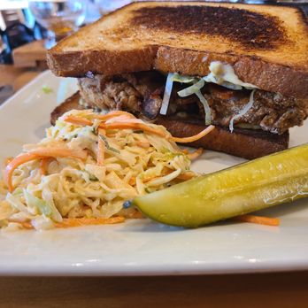 Cochon RESTAURANT - fried oyster and bacon sandwich. their take on the a blt with pickled green tomatoes. - Cajun/Creole Near Me - New Orleans, Louisiana