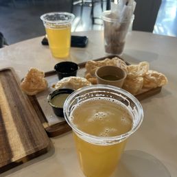 Delicious homemade chicharrones and their flavorful green sauce.We had wings too but forgot to take pic of them and refreshing beer Delicious homemade chicharrones and their flavorful green sauce.We had wings too but forgot to take pic of them and refreshing beer
