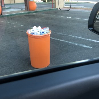 Quick Quack Car Wash - Over filled trash cans all over the lot - Car Wash Near Me - Mesa, Arizona