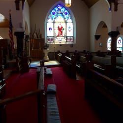 St Paul's Episc Church - Looking at the south transept in the nave of the church. You can see the Holy Family altar and the baptismal font.