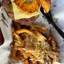 Slop's Food & Spirits - "shingler" pepper Jack cheese, jalapeños, and a grilled pineapple.   Also garlic Parmesan French fries.