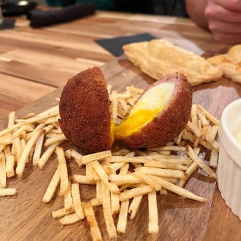 Cheeky Bastards - Scotch egg (and sausage rolls in the back) - Breakfast & Brunch Near Me - Indianapolis, Indiana