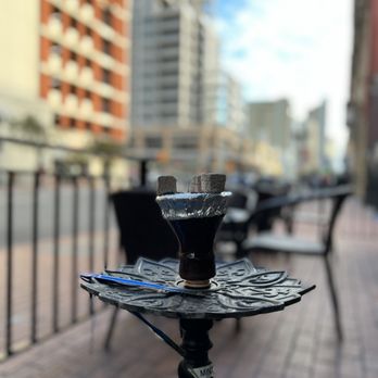 Mina Lounge - a table and chairs on a sidewalk - Hookah Bars Near Me - San Diego, California Mina Lounge - a table and chairs on a sidewalk - Hookah Bars Near Me - San Diego, California
