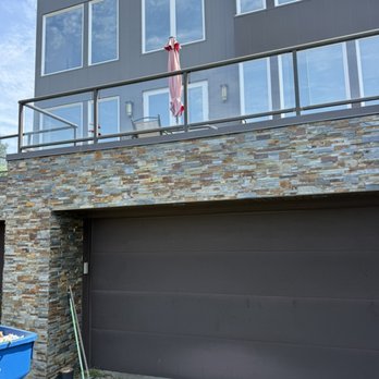 Vitalii - Natural stone veneer installation on the exterior façade of the house. - Handyman Near Me Vitalii - Natural stone veneer installation on the exterior façade of the house. - Handyman Near Me