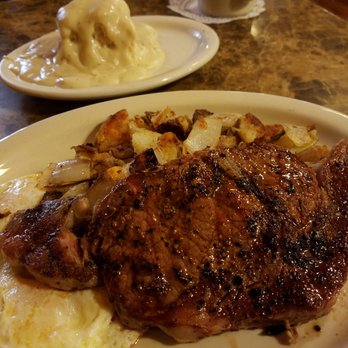 Mountain Top Cafe - Rib eye steak, eggs over easy, crispy country fried potatoes, biscuits and gravy, and coffee - American Near Me - Phelan, California