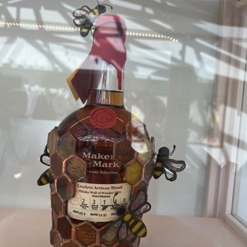 Maker's Mark Distillery - Lead glass artwork on a bottle in the welcome area. - Tours Near Me - Loretto, Kentucky Maker's Mark Distillery - Lead glass artwork on a bottle in the welcome area. - Tours Near Me - Loretto, Kentucky