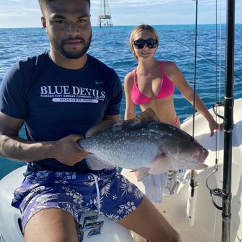 Key King Charters - My daughter caught a grouper. Devante coached her through the difficult fight and she was able to land it. Much thanks, Devante! - Boat Charters Near Me Key King Charters - My daughter caught a grouper. Devante coached her through the difficult fight and she was able to land it. Much thanks, Devante! - Boat Charters Near Me