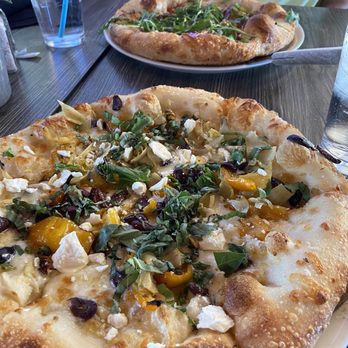 Picazzo's Healthy Italian Kitchen - Hot Honey, Fig and Salami Pizza in back Puttanesca Pizza in front - Gluten-Free Near Me - Gilbert, Arizona