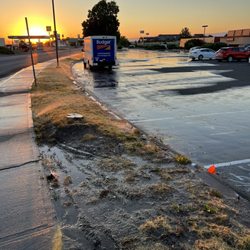 Red Lion Hotel Pendleton - Watering dead grass, dirt, pavement and flooding the Handicapped spaces.