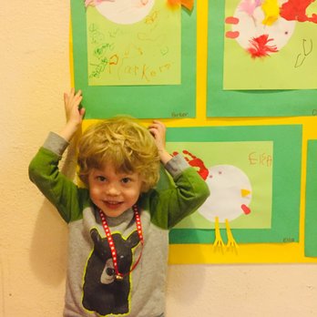 Bright Prospects Cooperative Preschool - One of our students proudly standing by his work. - Preschools Near Me - Minneapolis, Minnesota Bright Prospects Cooperative Preschool - One of our students proudly standing by his work. - Preschools Near Me - Minneapolis, Minnesota