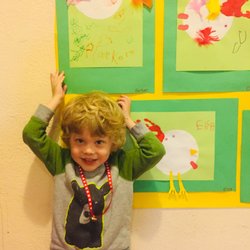 Bright Prospects Cooperative Preschool - One of our students proudly standing by his work.